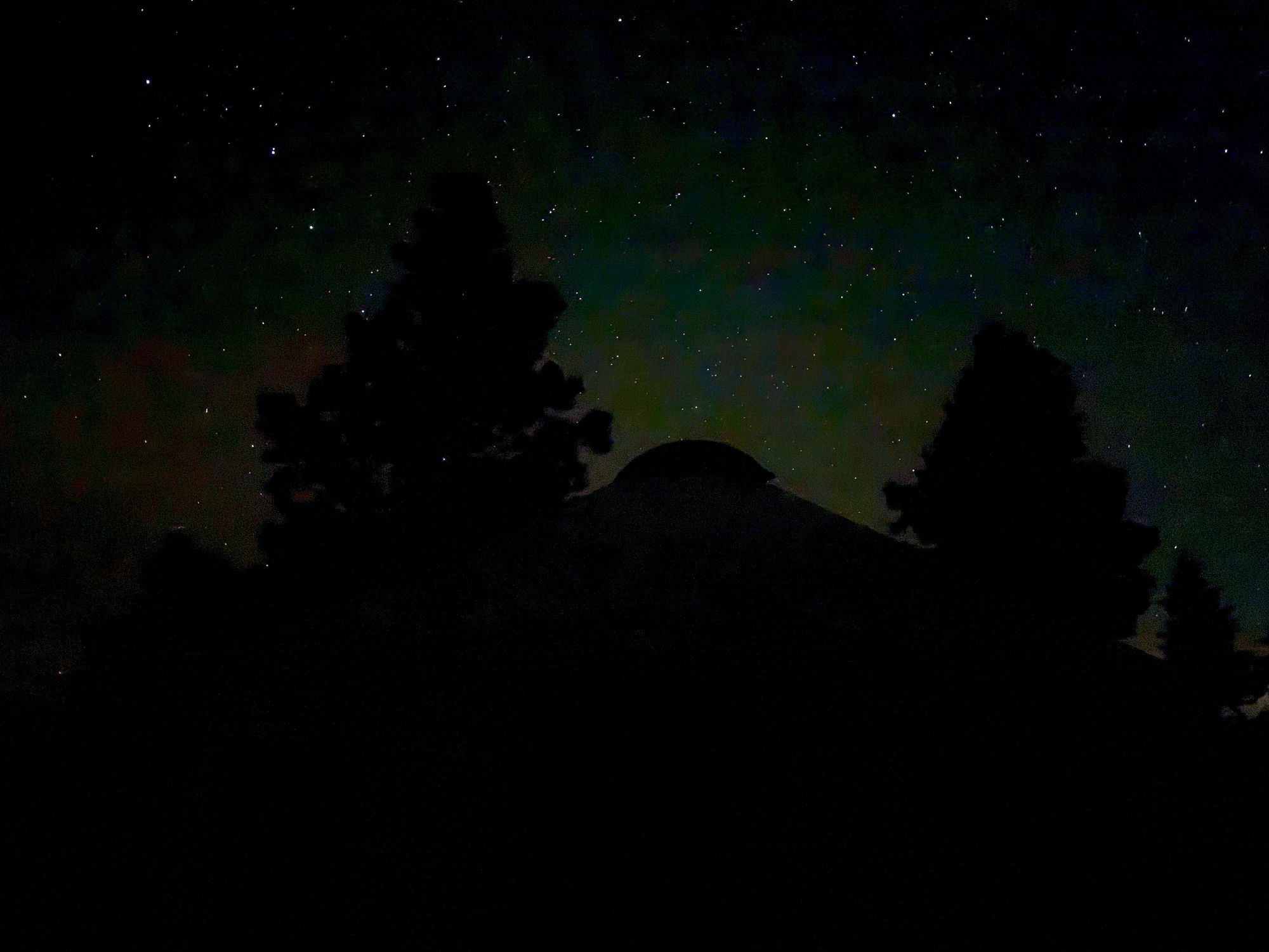 Yurt dome silhouetted against a starry night sky in the San Juan Mountains
