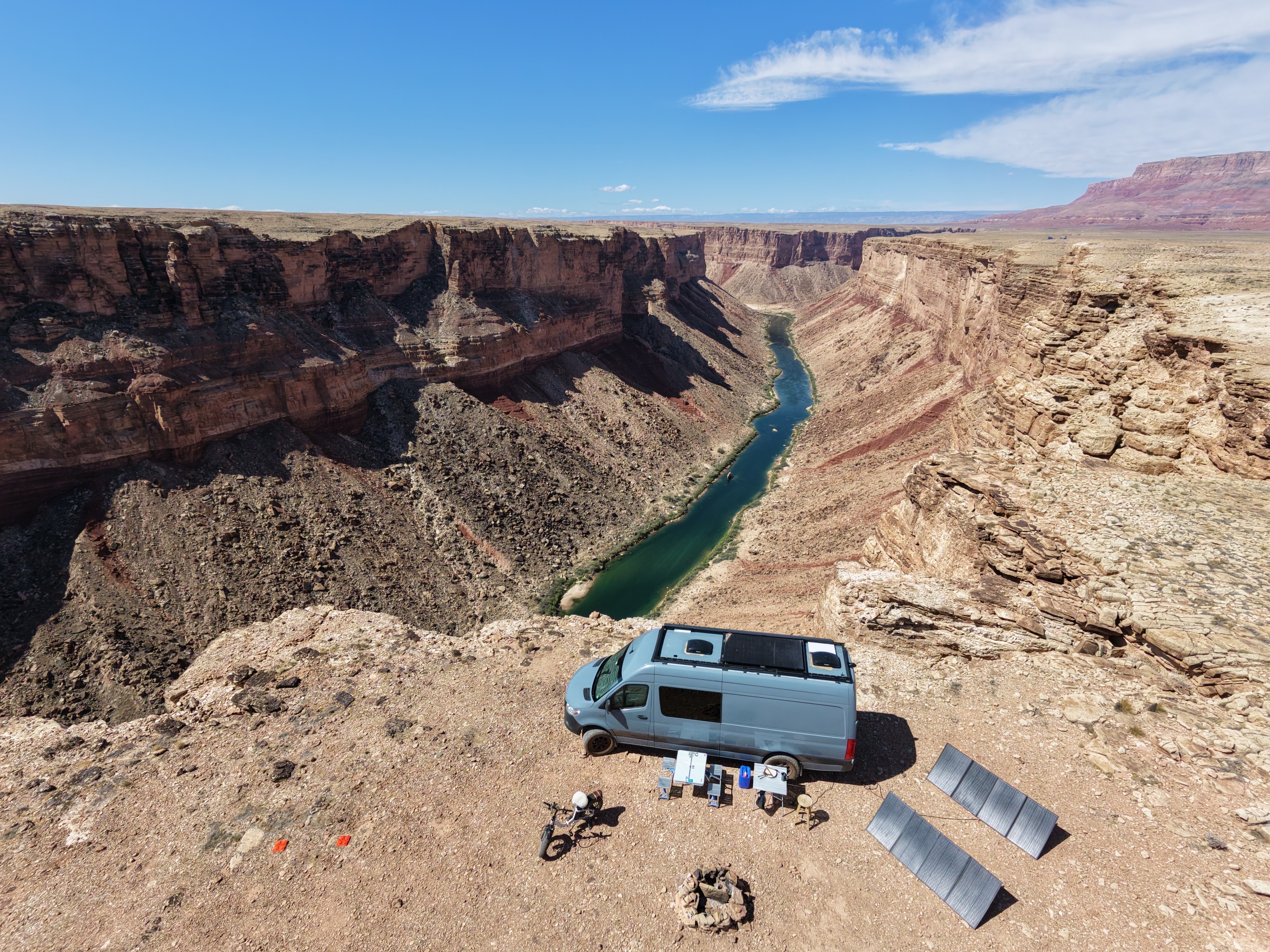 Drone shot of the van parked on the canyon rim, Colorado River below